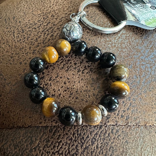 Schlüsselanhänger HOUSE OF RIDERS, schwarze und braune Perlen.